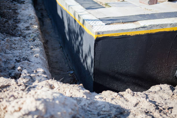 Professional Basement Waterproofing technician working in Sardinia, OH